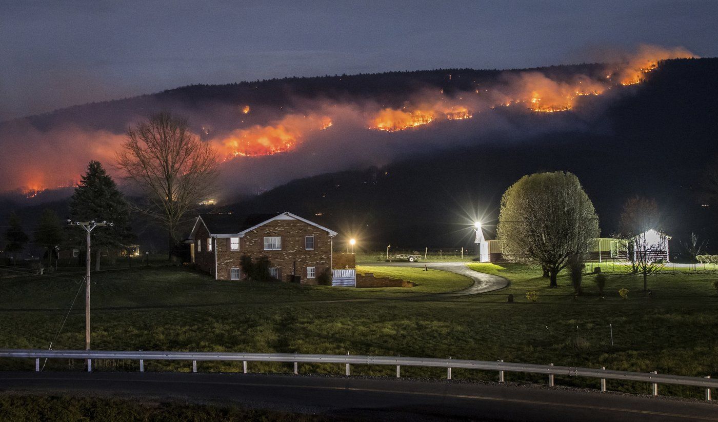 National Guard helicopters help battle West Virginia wildfires in steep